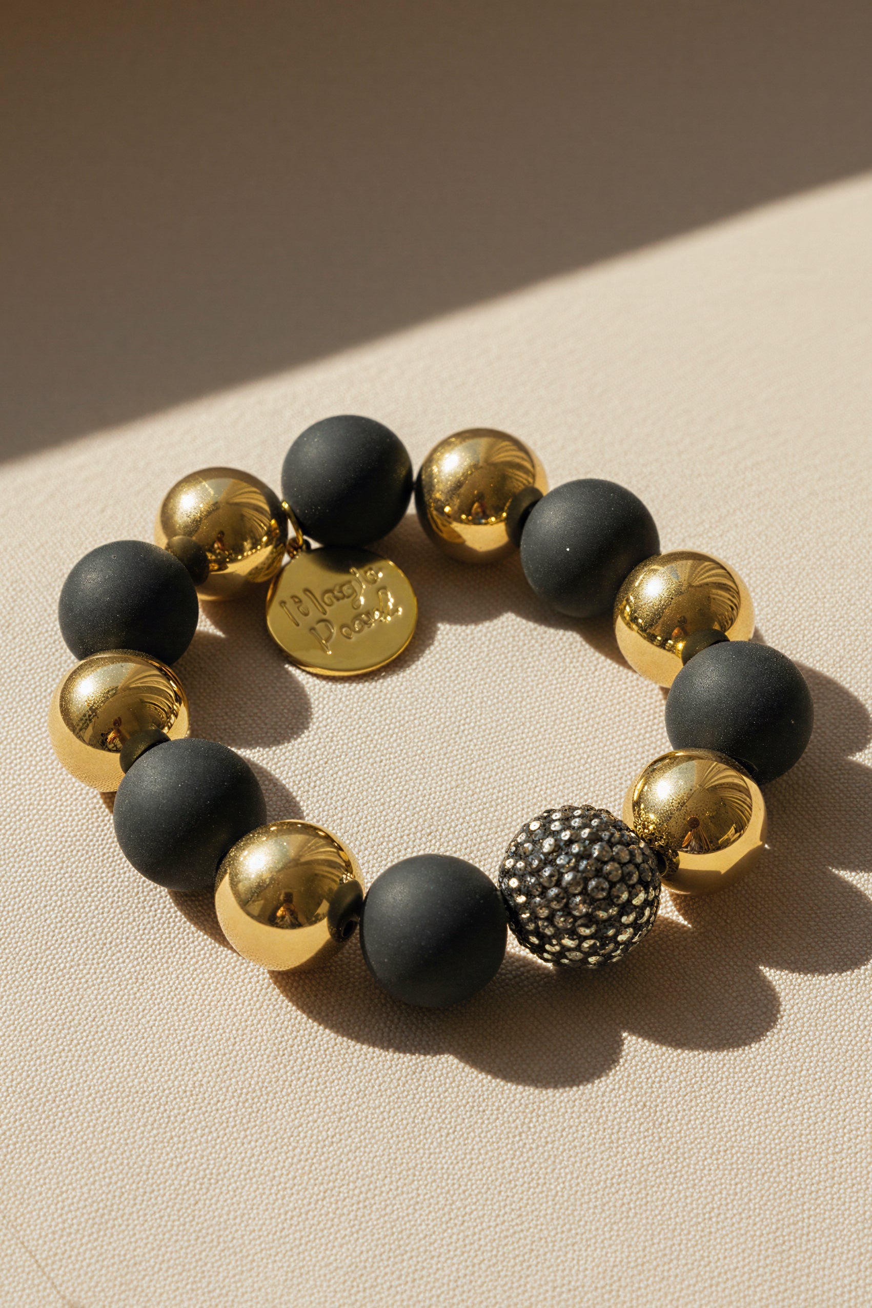 Perlenarmband Schwarz-Gold