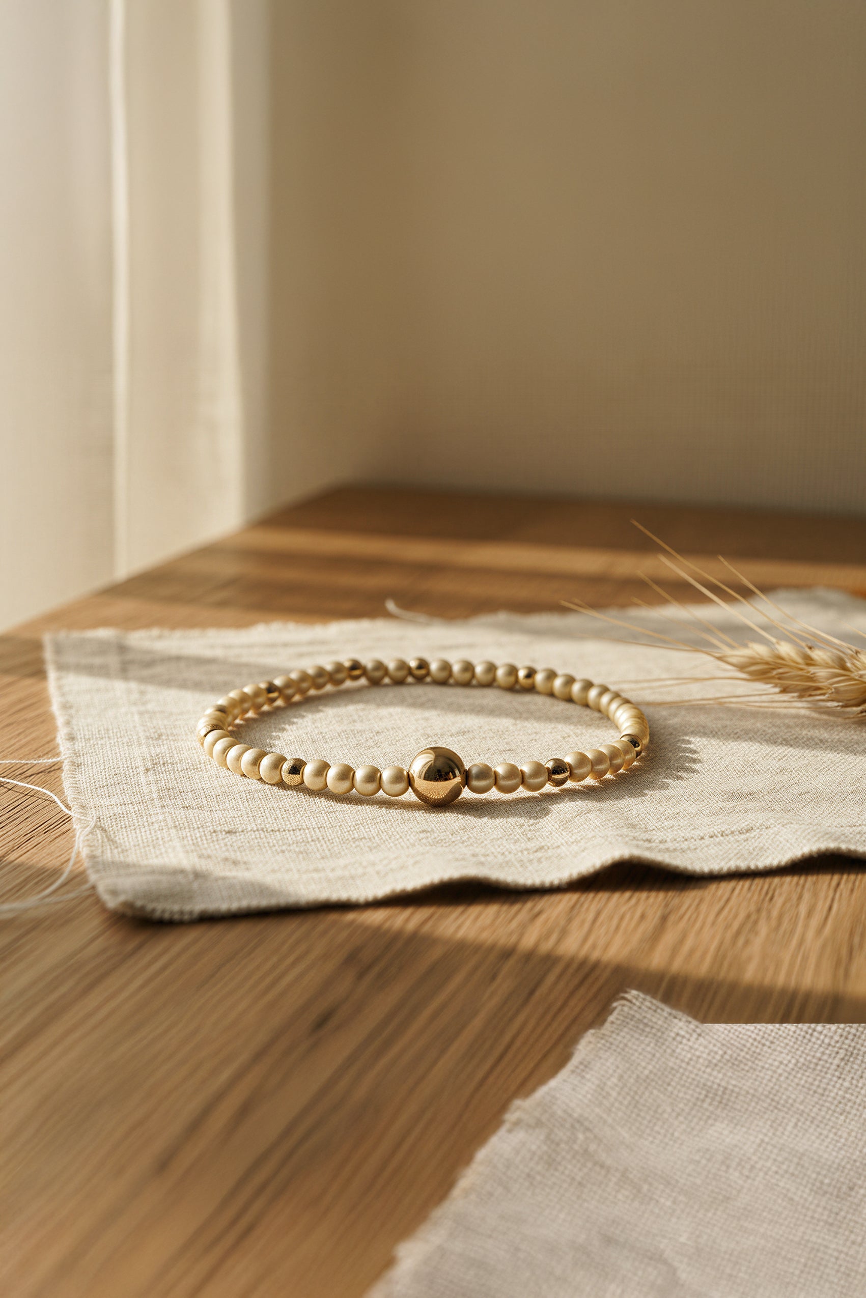 Perlenarmband, champagner und gold