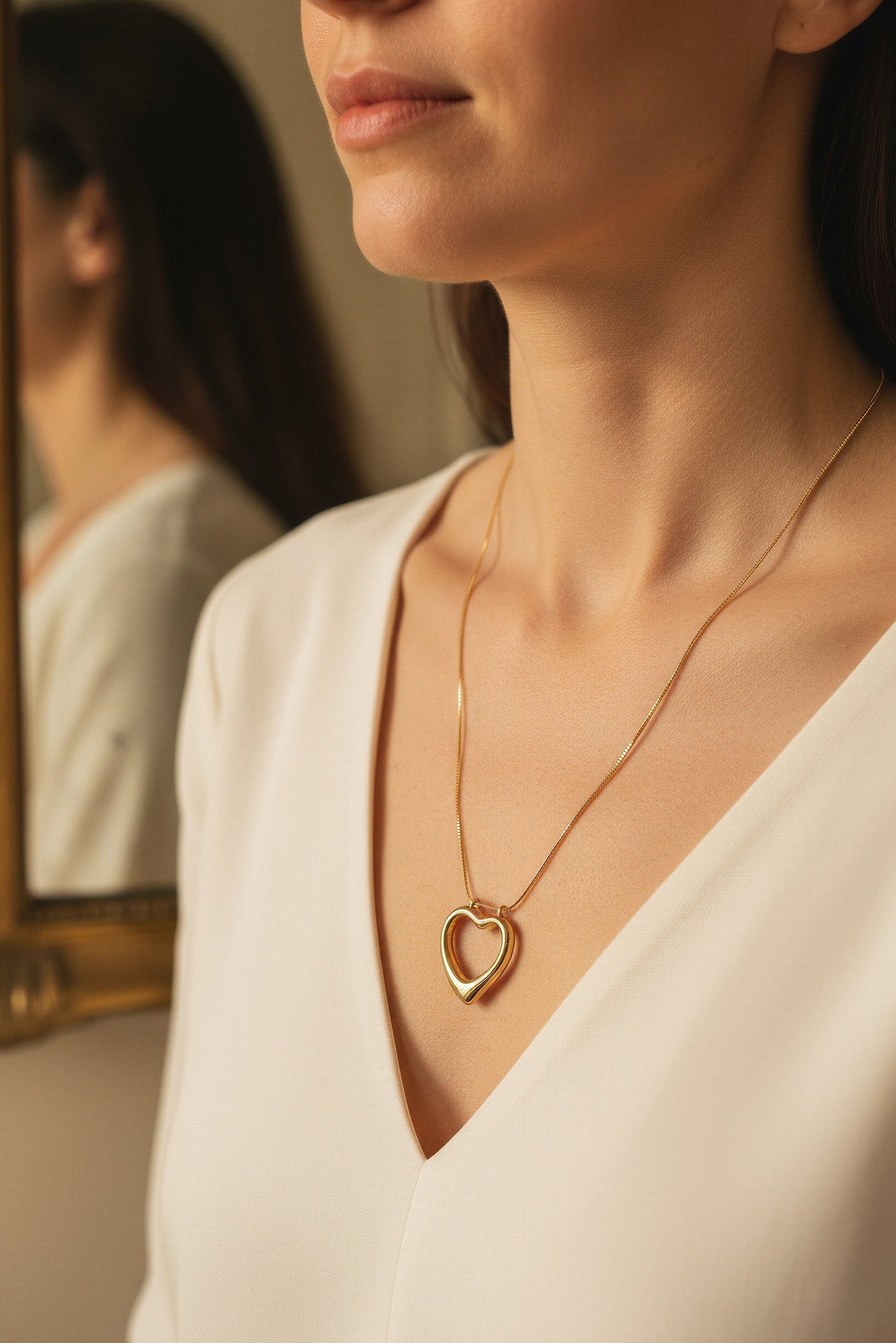 Goldkette mit offenem Herzanhänger