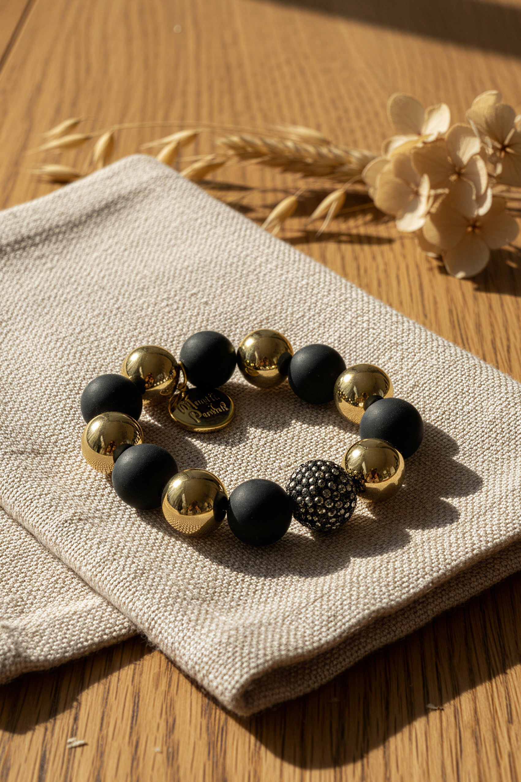 Perlenarmband Schwarz-Gold