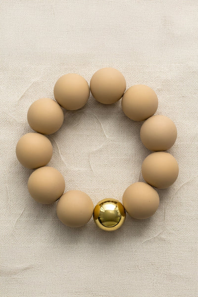 Armband aus Acryl mit goldfarbener Kugel