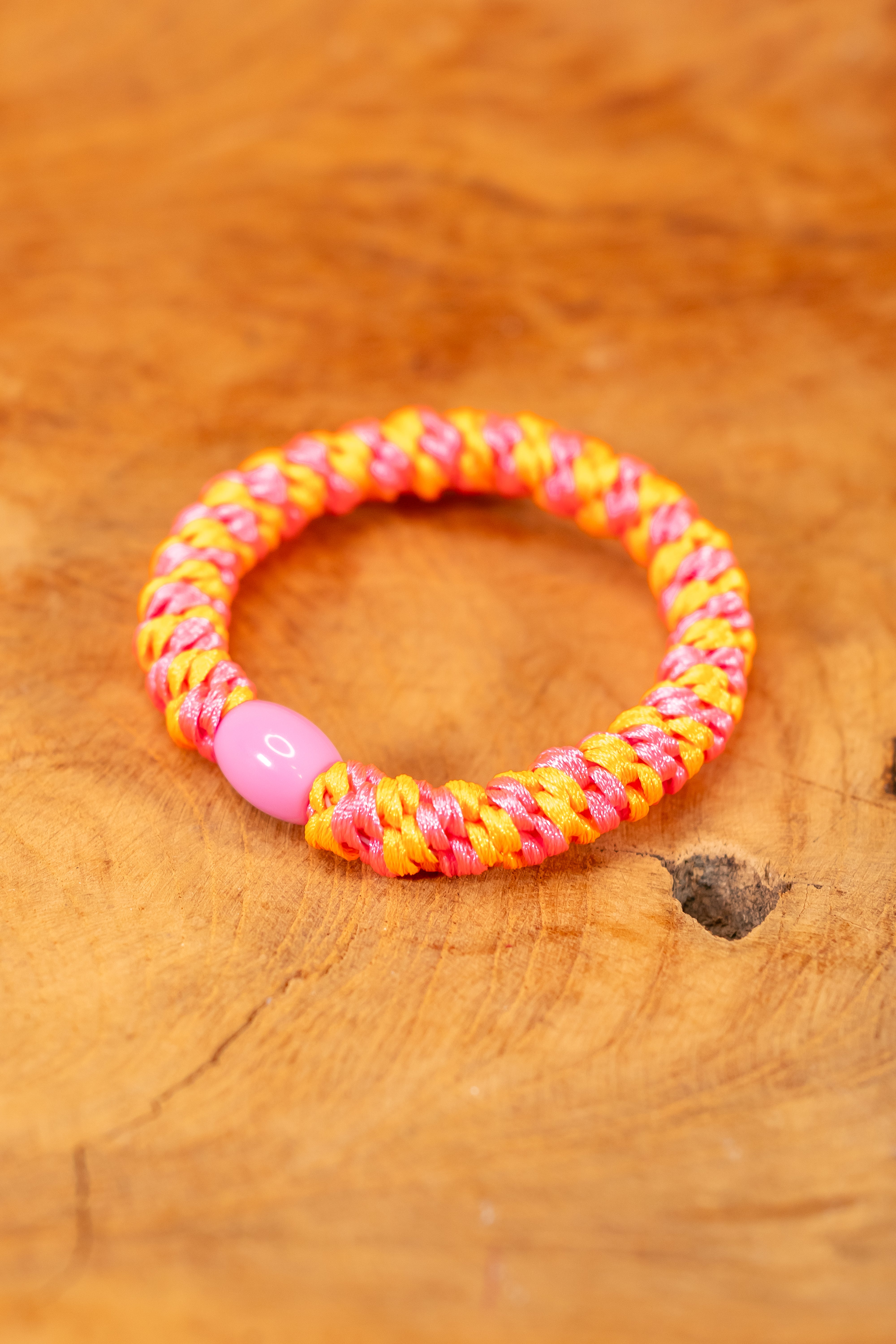 Geflochtenes Haargummi, pink-orange