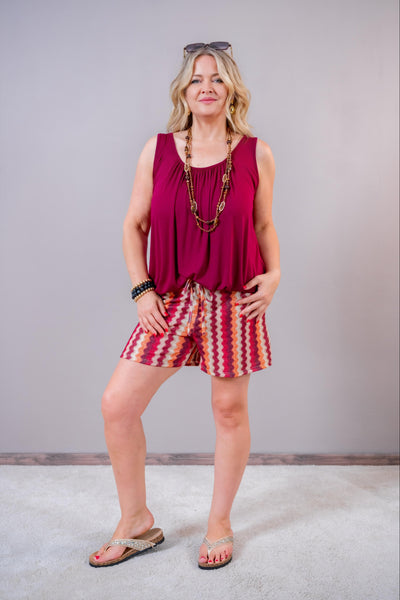 Kurze Hose mit Muster und Glitzer-Effekt, rot/orange/creme