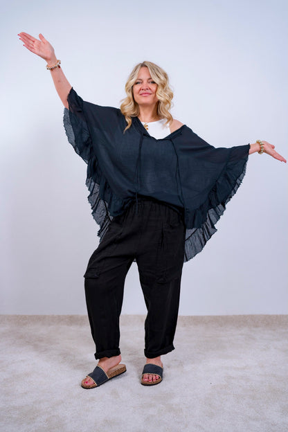 Volant-Bluse mit ausgefransten Saum, schwarz